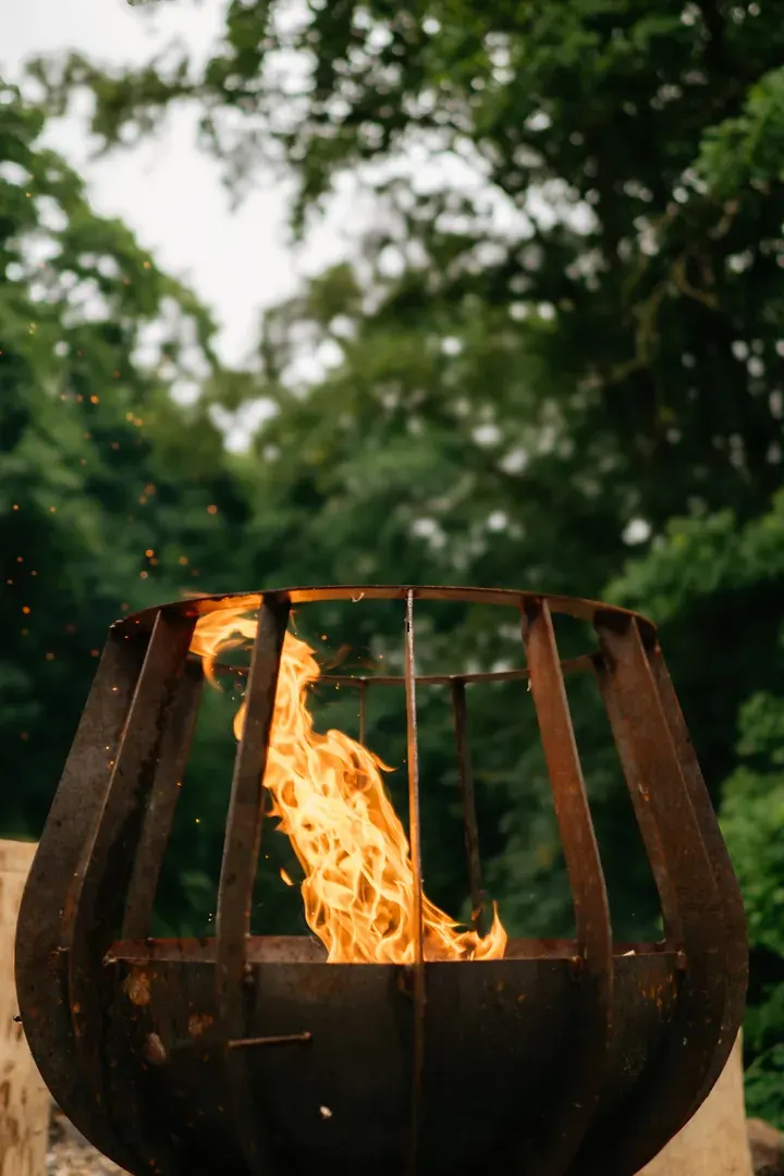 Fire in the fire pit by the cabin